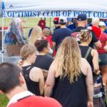 People queuing at the Port Colborne Optimist Club tent on Canada Day 2025